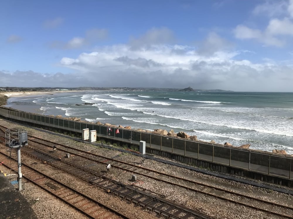 View of the train line, and the blue sea on a sunny day.
